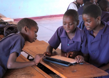 small group of pupils working with a netbook computer